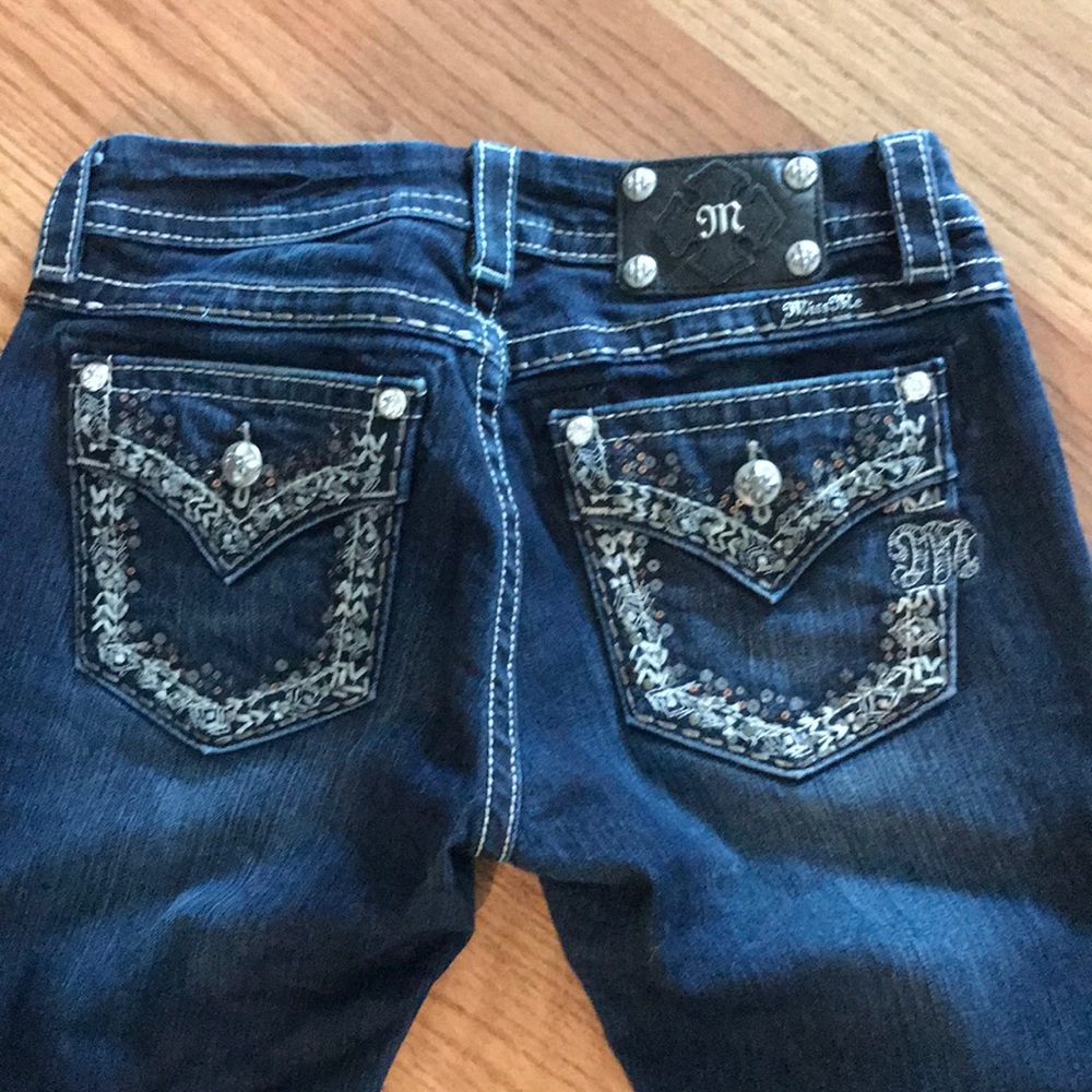 Miss Me Jeans size 28 with 32” inseam.